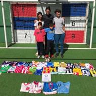 Sebastian Abreu with his certificate and a shirt from every club he's played for
